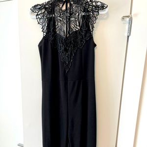 Black Jumpsuit with lace neck. Size US8
